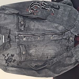Distressed  Black Jean Jacket with sewn in applique of tiger and rose.